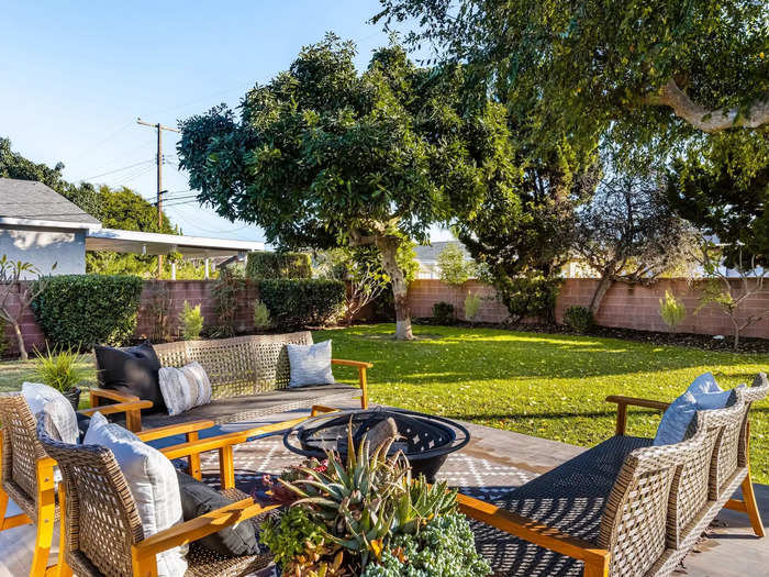 The backyard has a patio.