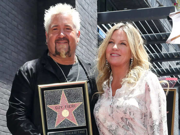 Fieri first met his wife after firing her friend from his restaurant.