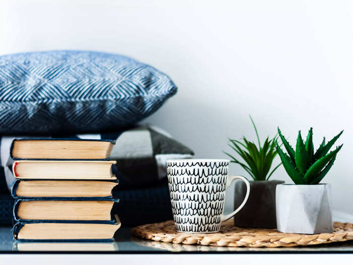 Use your many large coffee table books as an end table.