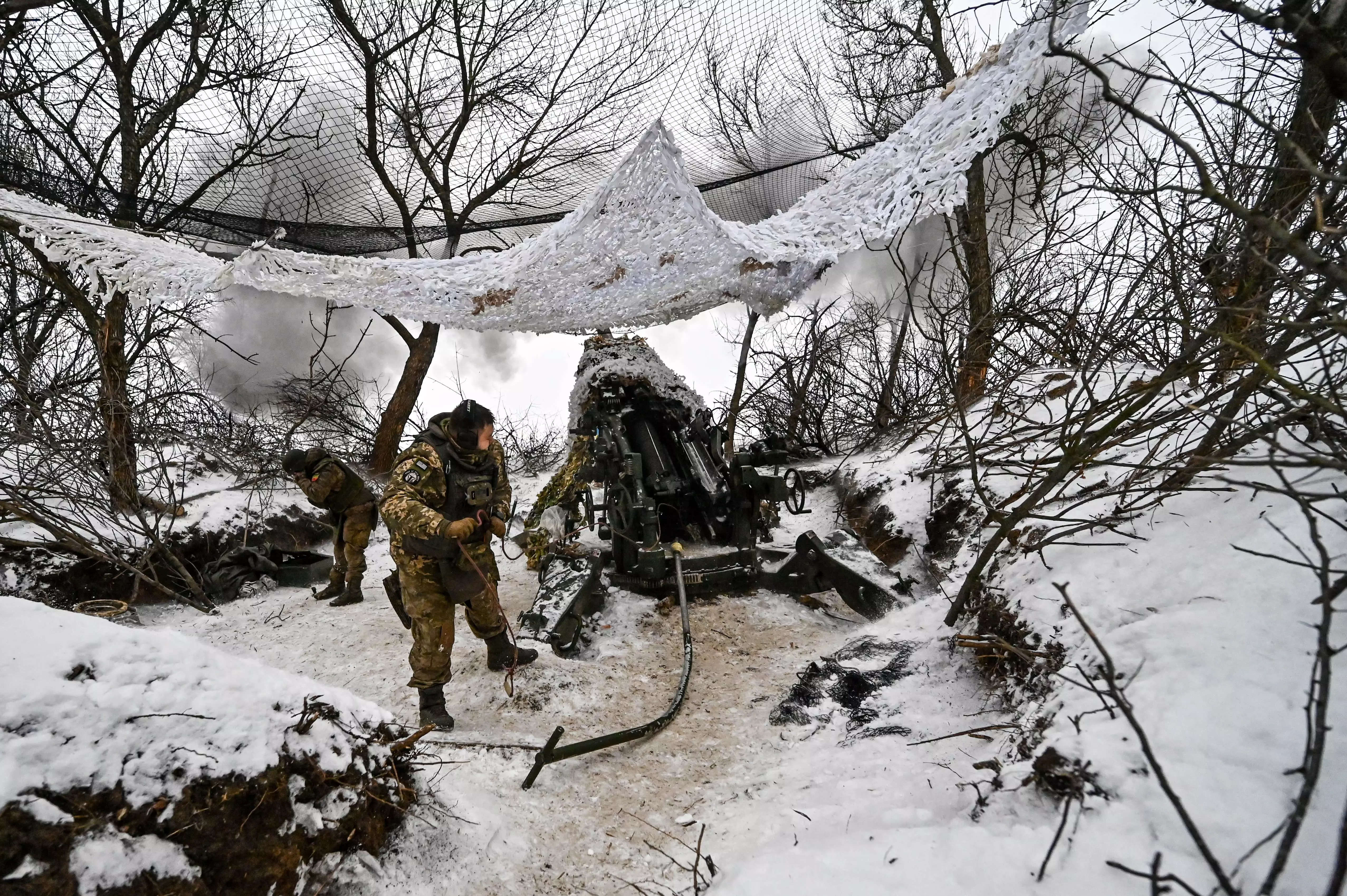 A serviceman of the 66th separate cannon artillery battalion of the 406th separate artillery brigade of the Armed Forces of Ukraine is pictured by the American M777 howitzer, Zaporizhzhia direction, south-eastern Ukraine.