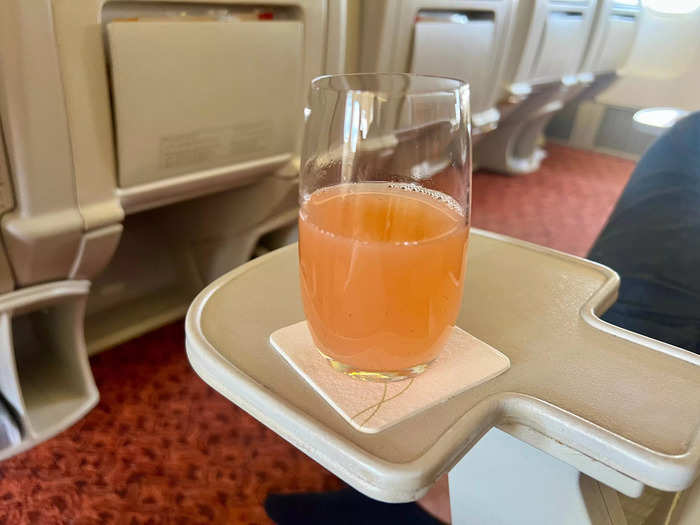 I made my way to seat 9D and enjoyed a welcome drink and hot towel as I settled in.