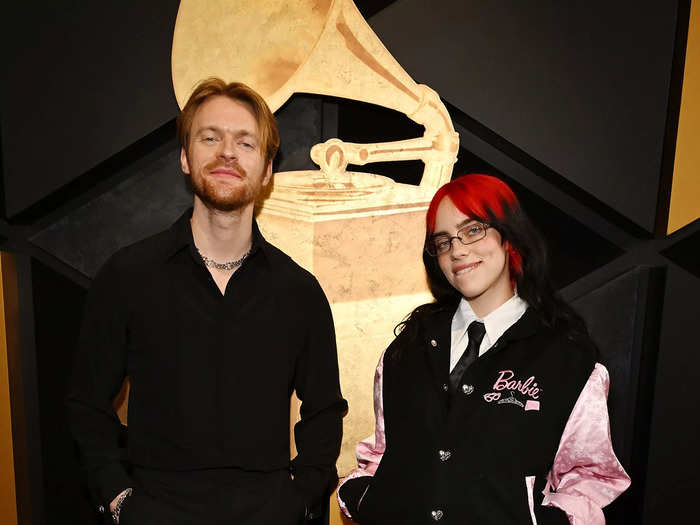 Finneas wore a black shirt and trousers, contrasting with Billie Eilish