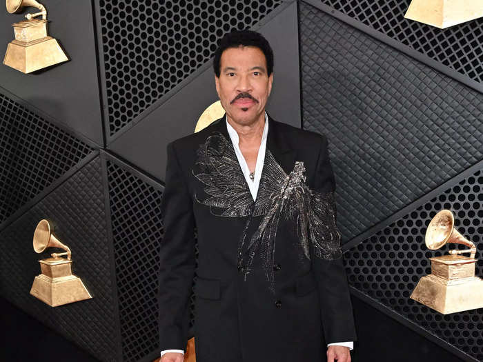 Lionel Richie wore a black suit with a dragonfly embroidered across the jacket.