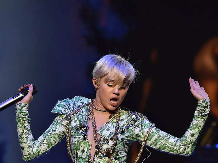 She wore dozens of unique looks during her 2014 Bangerz Tour — including this leotard that was made from fake money.