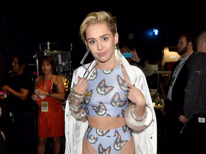 Towards the end of 2013, Cyrus wore cat-print swimwear and matching platform heels for an awards show.