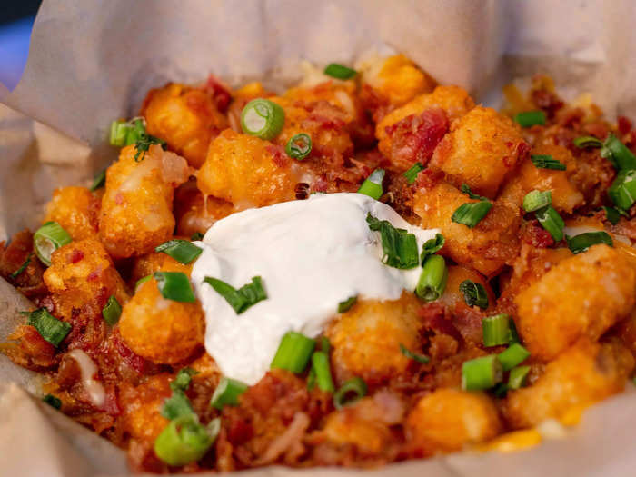 Making loaded tater tots is another easy way to utilize your air fryer on game day.