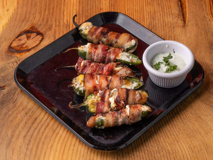 Bacon-wrapped jalapeño poppers are another crowd-pleaser on game days.