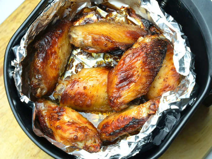 Chicken wings are easy to make in an air fryer before tossing with your favorite sauce.