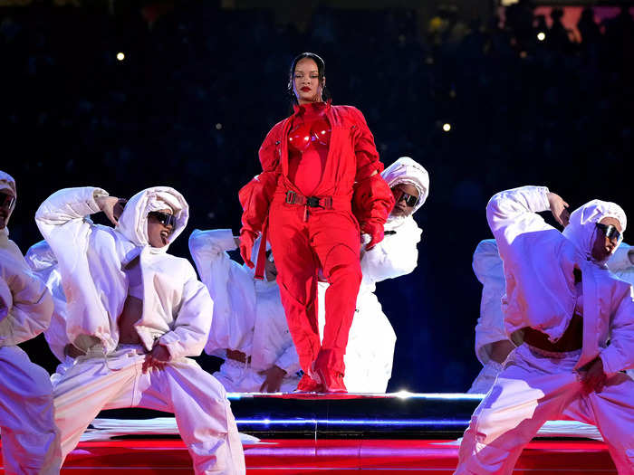 Rihanna strategically chose an unzipped red jumpsuit to reveal that she was pregnant during her 2023 performance.