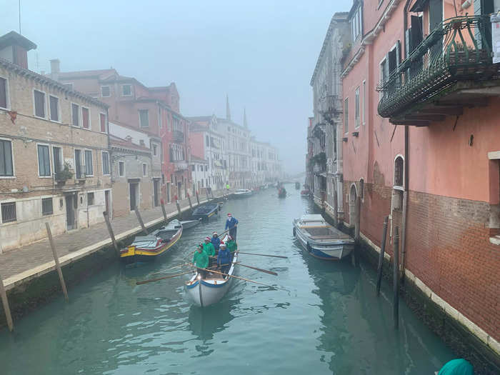 As we continued walking, we saw a procession of boats, with each rower dressed in Santa hats.