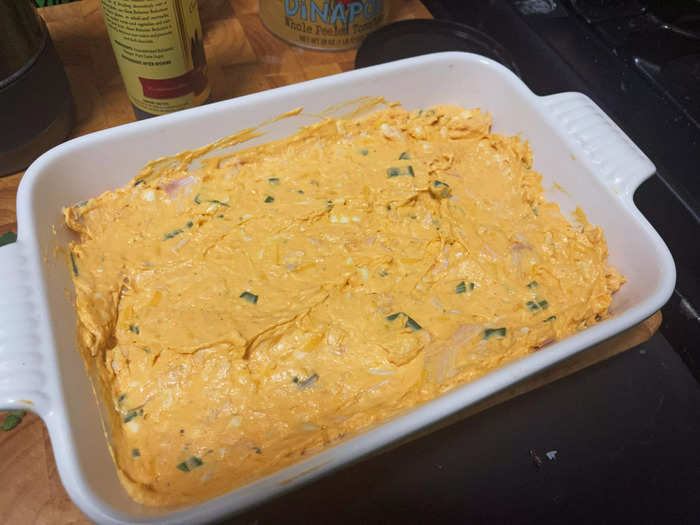 After the dip was fully mixed, I spooned it into an 11-inch-by-7-inch casserole dish.