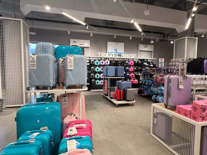 I headed across the floor to the Travel Shop, which displayed suitcases and travel accessories, like $8 neck pillows.