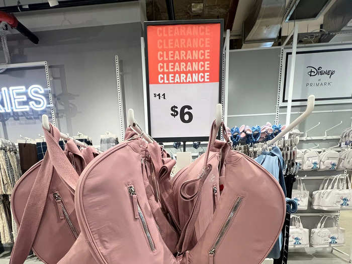 Crossbody bags were on sale for $6, down from $11. This clearance sign became a familiar sight.