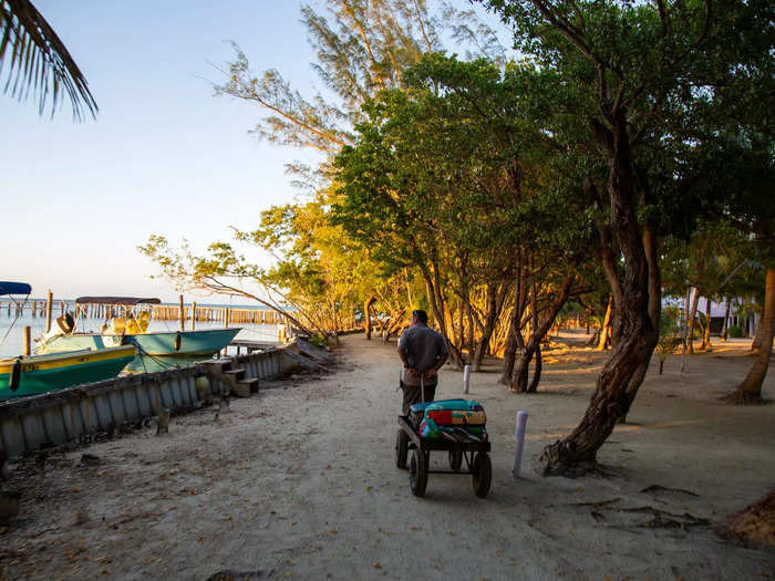 A worker carted our luggage and led the way down a sandy path.