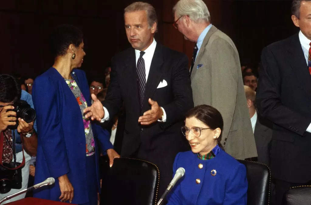 US Court of Appeals (for the District of Columbia) Judge Ruth Bader Ginsburg (1933 - 2020) (seated) prior to her Associate Justice of the US Supreme Court confirmation hearing before the US Senate Committee on the Judiciary on Capitol Hill, Washington DC, July 20, 1993. Standing behind her are, from left, Delegate Eleanor Holmes Norton, US Senate Committee on the Judiciary Chairman US Senator (and future US President) Joe Biden, and US Senator Daniel Patrick Moynihan (1927 - 2003).