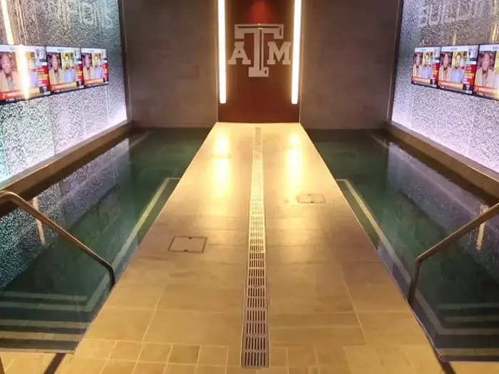 Check out all the TVs along the walls of the pools in the Texas A&M football facility