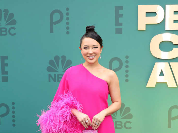 Content creator Ashley Yi showed up in an off-shoulder dress with matching hot pink platform heels.