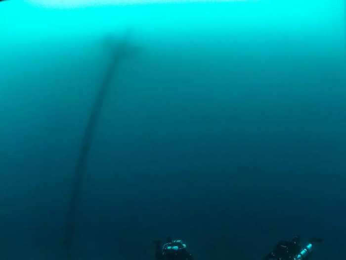 The wheel of this 19th-century wooden schooner is still intact at the bottom of Lake Huron.