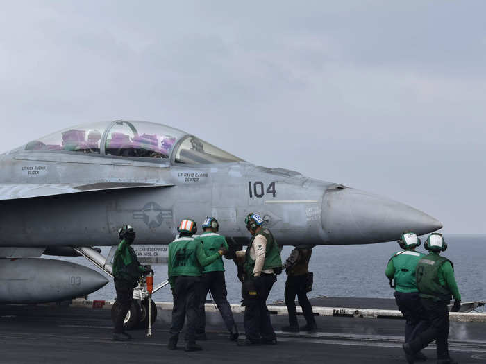 These service members are constantly in the process of receiving planes, launching them, or getting aircraft ready for their next launch.