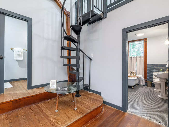 A winding staircase leads guests to the second-story loft.
