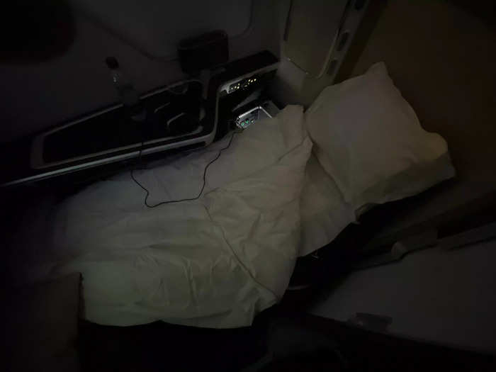 The crew transformed my seat into a bed, and I had no trouble falling asleep.