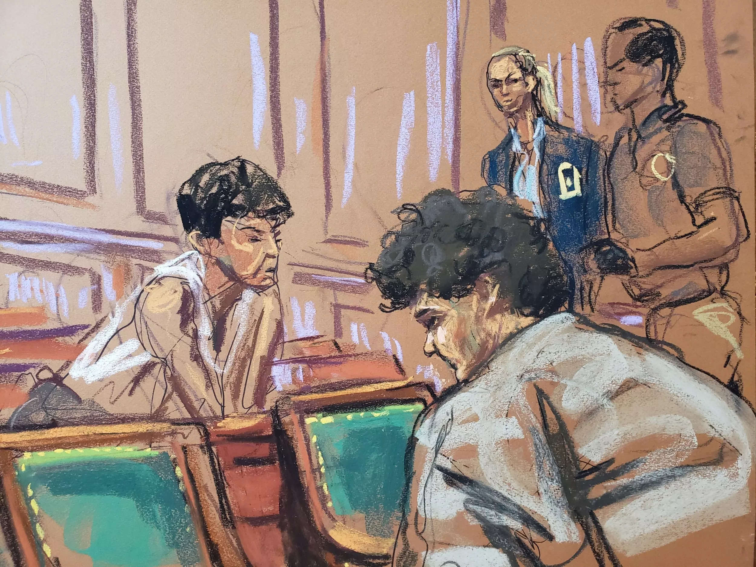 A court drawing of Sam Bankman-Fried speaking to his mother in the courtroom.