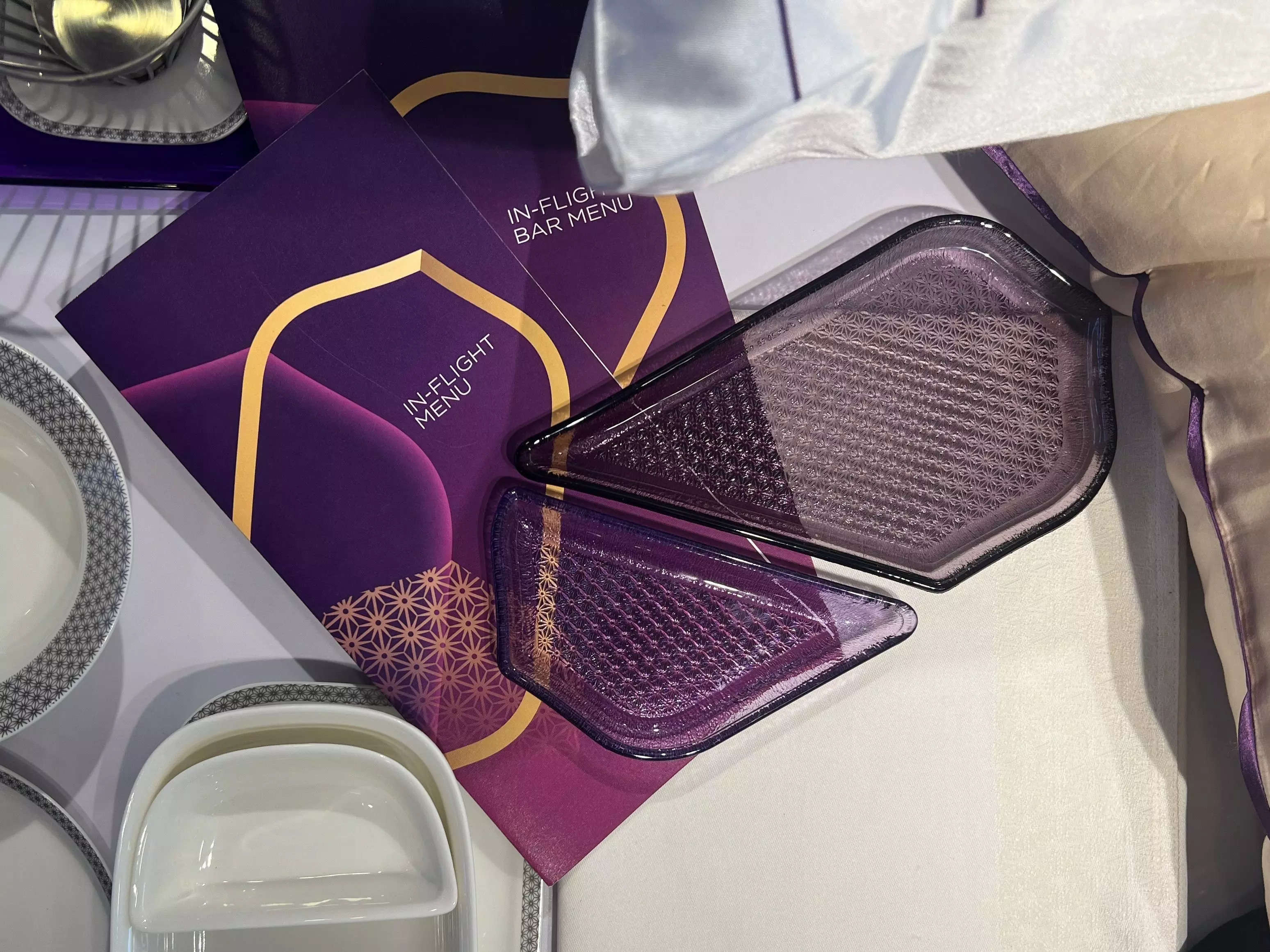 The gold Vista logo on a purple inflight menu.