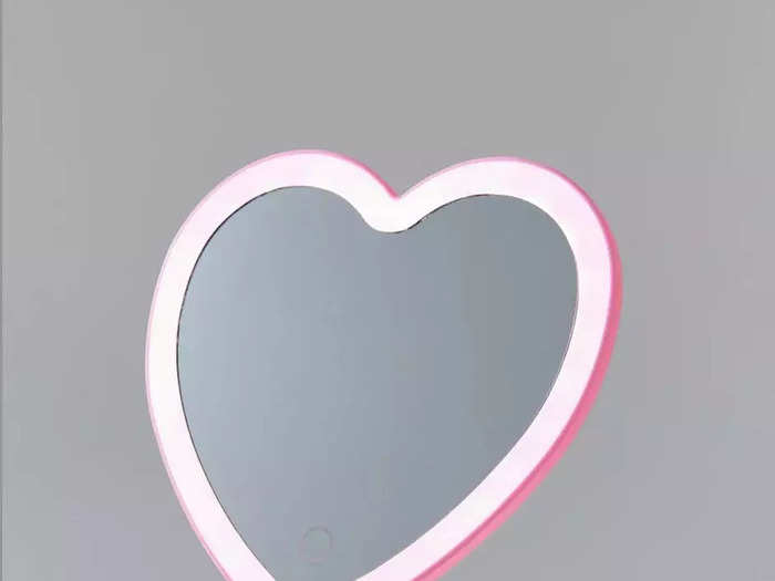 This heart-shaped mirror with a ring tray is sold at Urban Outfitters for $20. It requires three AAA batteries.