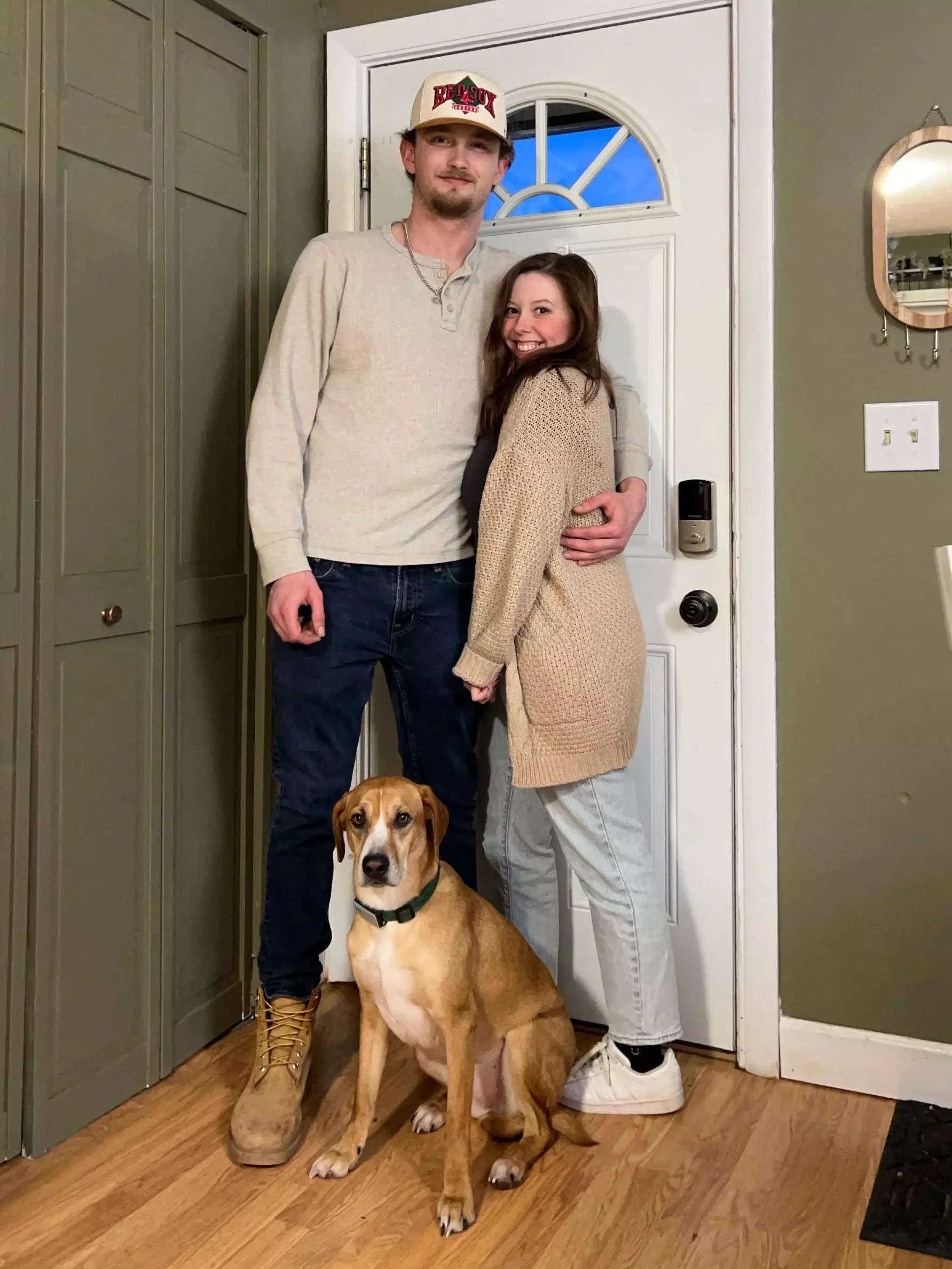 Grace Lucchese, Mickey Ricard, and their dog at home.