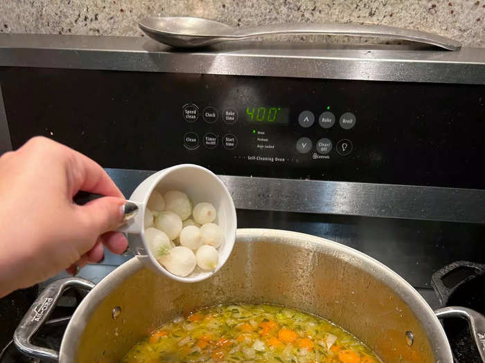 While my croutons were baking, I added the chicken, peas, and pearl onions to my soup. 