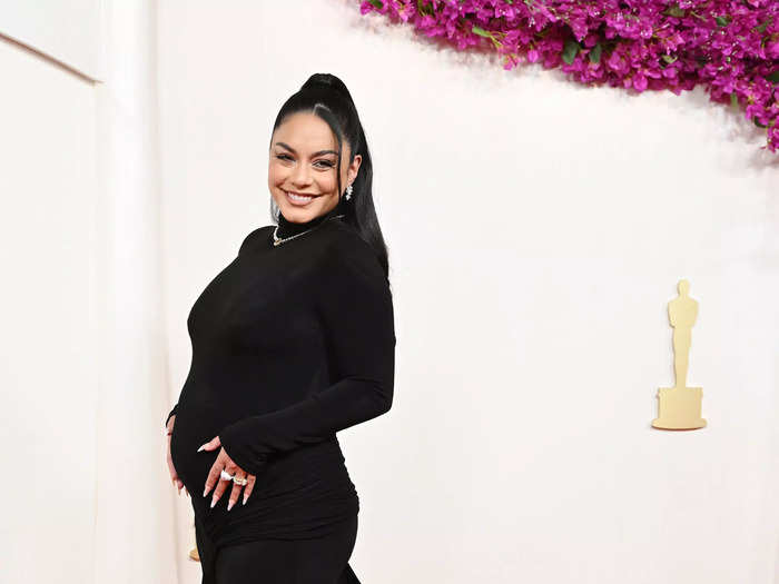 Vannesa Hudgens turned the 2024 Oscars red carpet into her pregnancy reveal.