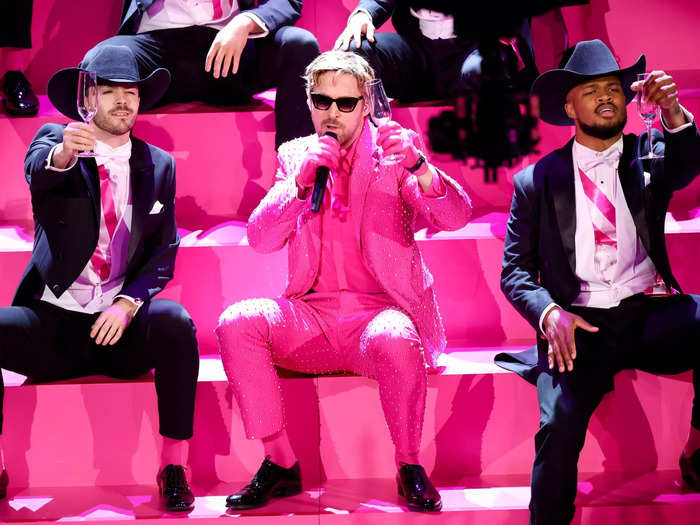 Gosling then hit the stage in a Barbie-pink suit from Gucci to perform "I