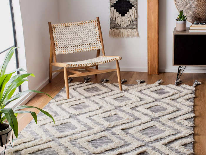 You should almost always splurge on the bigger rug to make a room feel larger than it is.