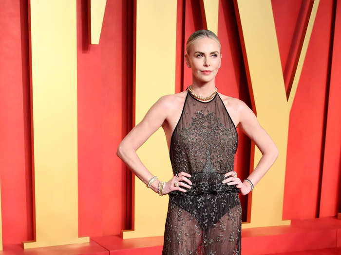 Charlize Theron wore a black dress featuring a peplum skirt and exposed underwear.