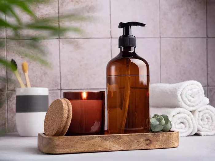 Replacing store-bought shampoo or soap bottles with neutral glass ones can also make your bathroom or kitchen look higher-end. 