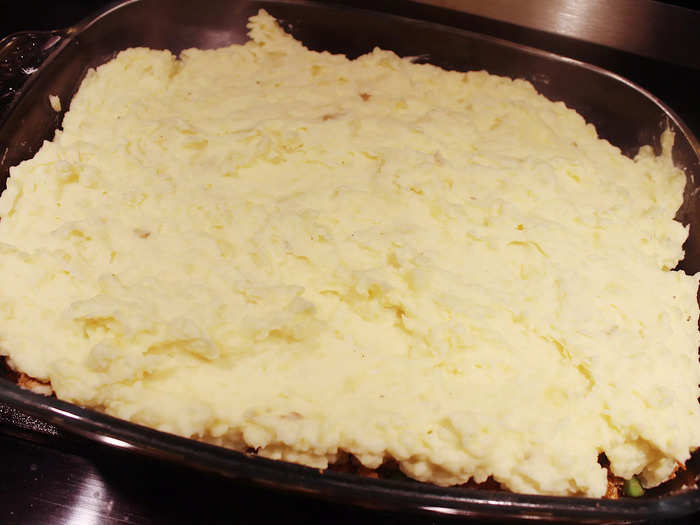 I then spread the creamy mashed potatoes over the filling, making sure to get it up to the edges of the pan.