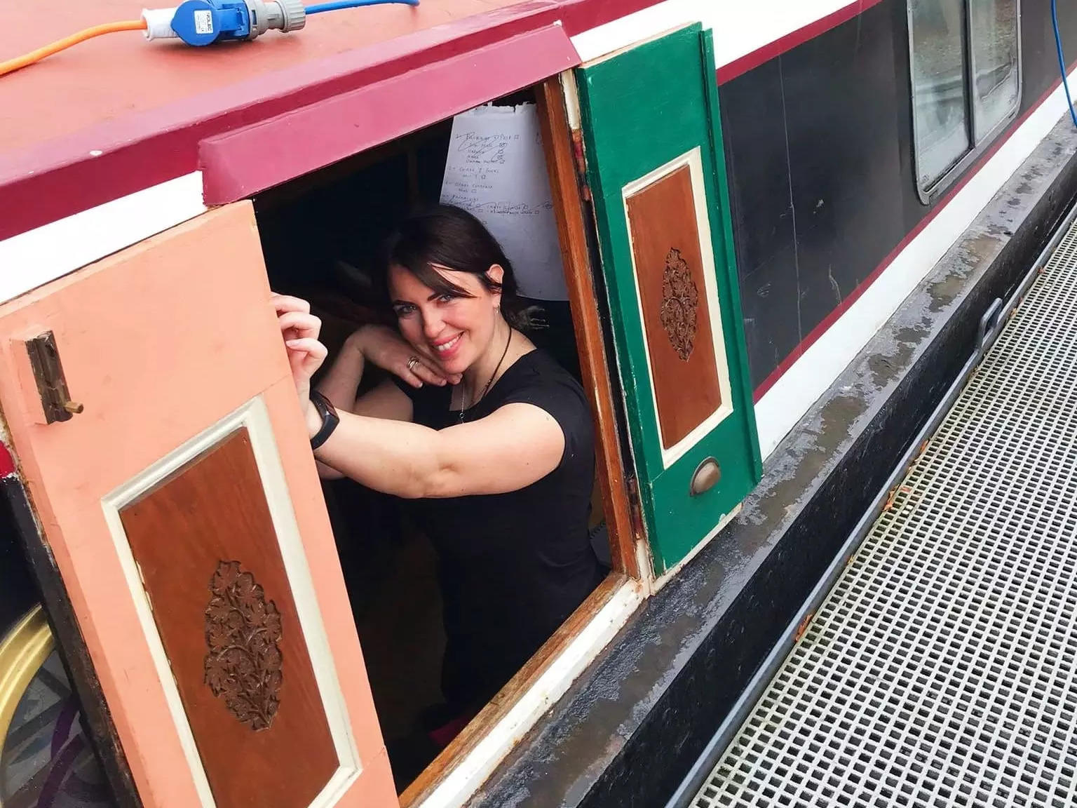 A woman onboard a narrowboat in England
