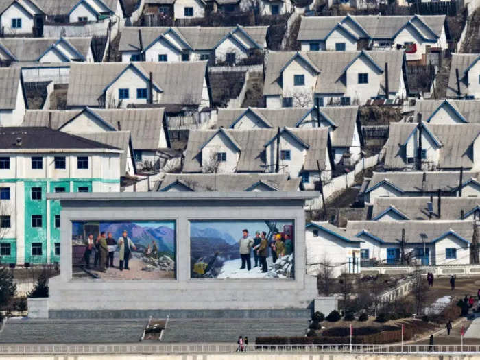 Portraits of former North Korean leaders Kim Il sung and Kim Jong Il in Chunggang.