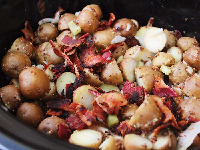 Another option is a warm German potato salad with ingredients like mustard, crispy bacon, and softened celery.