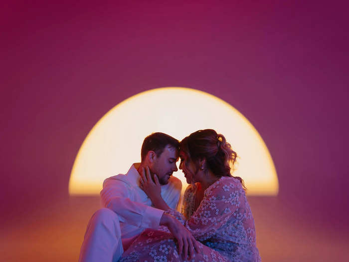 In this image, the sunset frames a couple in Toronto.