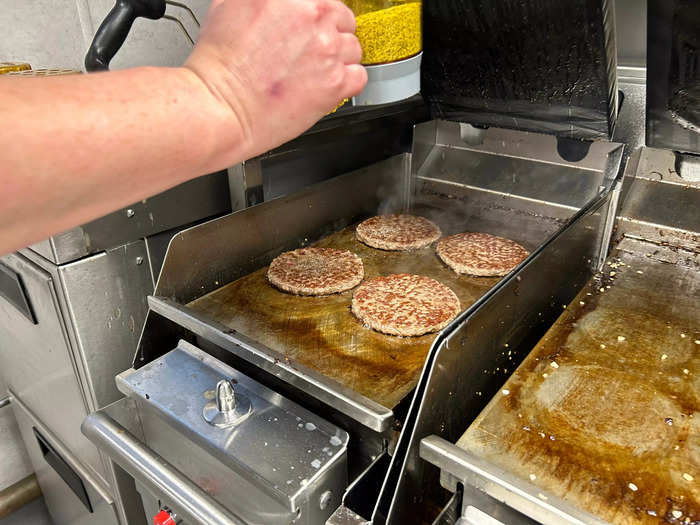 The burger patties are also being cooked differently.