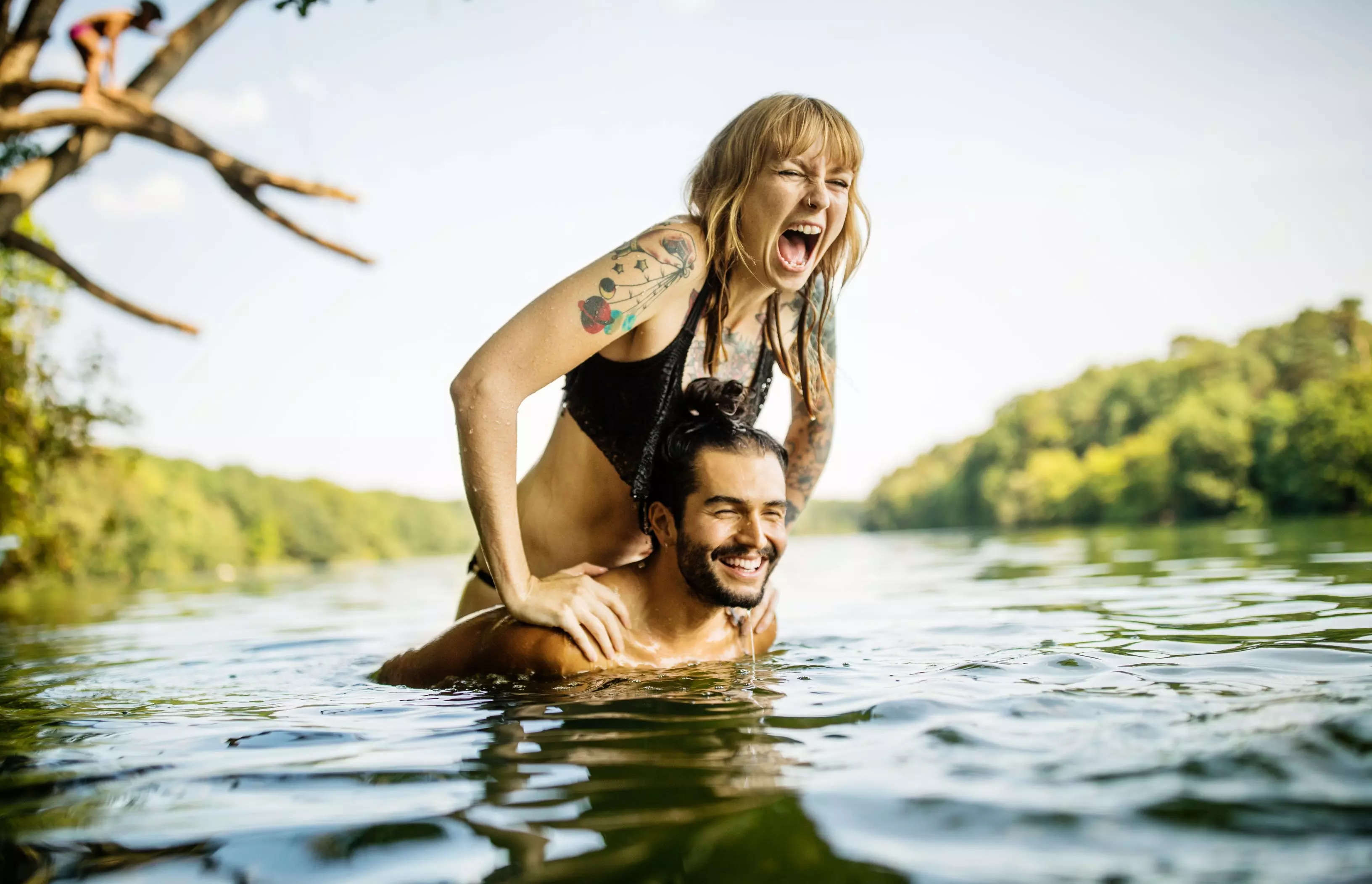 Couple having fun in lake.