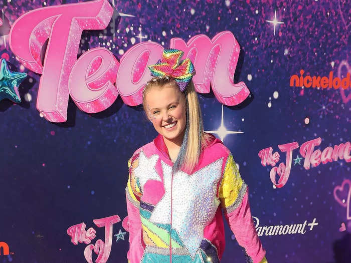 JoJo Siwa attended a screening of her movie "The J Team" in September 2021 while wearing a pink velour jumpsuit covered in a rainbow star pattern.