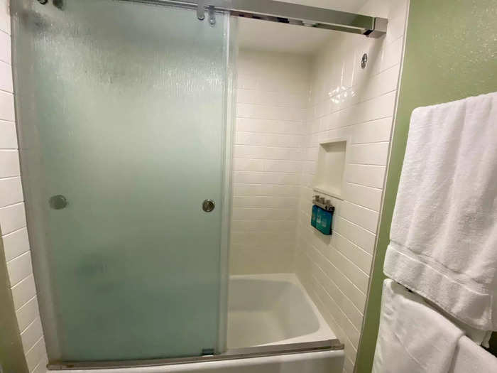 The toilet, shower, and towels were in a separate part of the bathroom that could be closed with a sliding door.