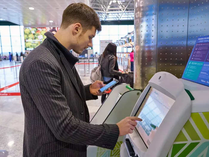 Today, travelers can check themselves in on kiosks.