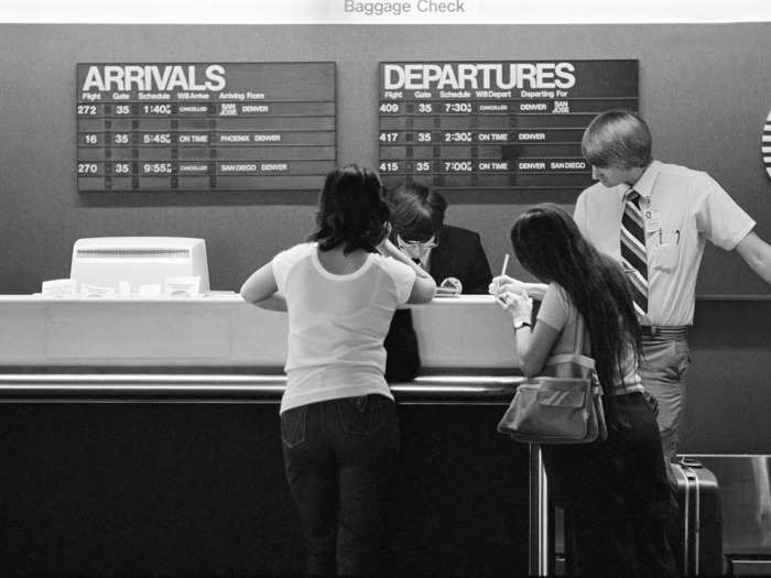 Gate agents once used old-school computers to check travelers in.
