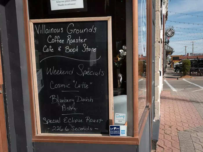 A local coffee store posts an eclipse-themed menu in Perryville, Missouri featuring a "cosmic latte"