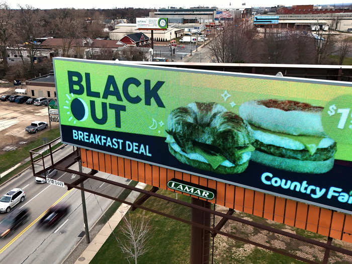 A billboard promotes the breakfast sandwich offer - named the "Black Out Special."