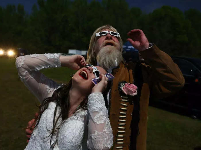 During totality, couples exchanged vows in a mass wedding ceremony as part of the Total Eclipse of the Heart festival in Russellville, Arkansas.