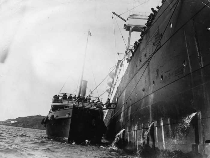 As the Carpathia made its journey into New York, reporters hired tug boats to sail alongside the ship to talk to survivors.